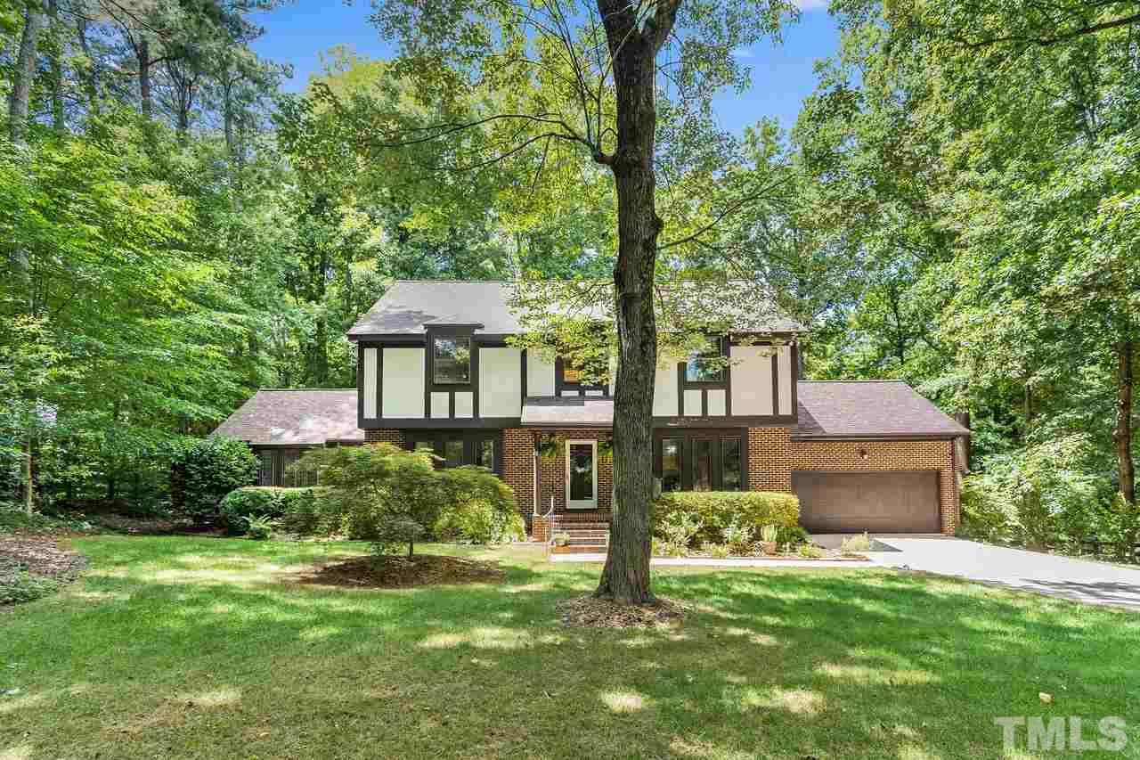 9028 Oneal Road Raleigh, NC 27613 - Photo 1 of 30 a front view of a house with a garden