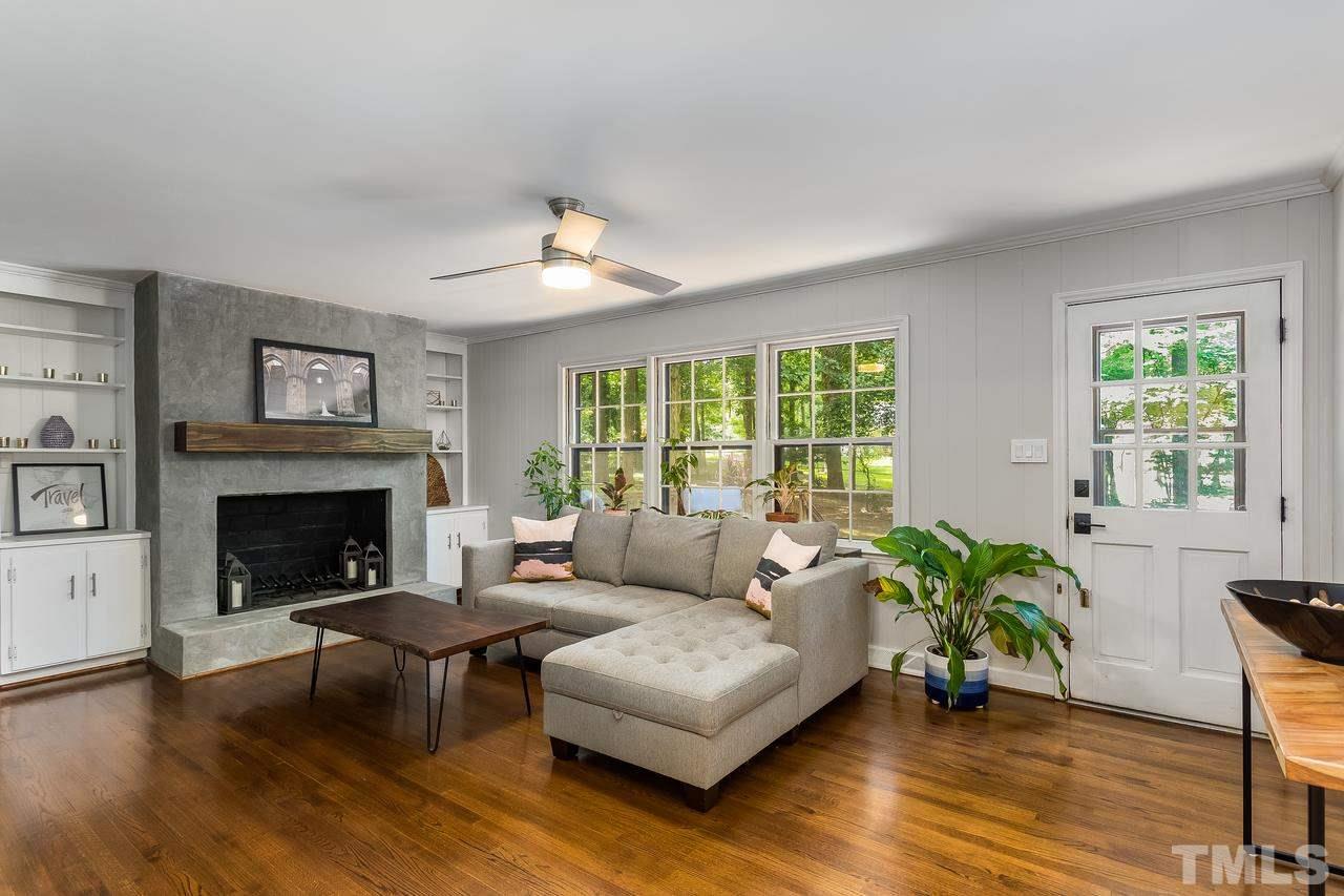 9028 Oneal Road Raleigh, NC 27613 - Photo 12 of 30 a living room with furniture and a fireplace