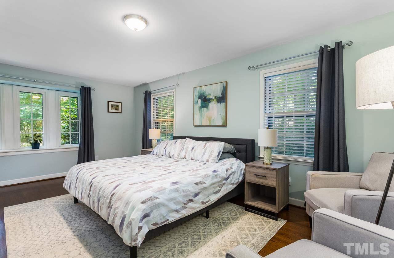 9028 Oneal Road Raleigh, NC 27613 - Photo 15 of 30 a bedroom with a bed and a couch