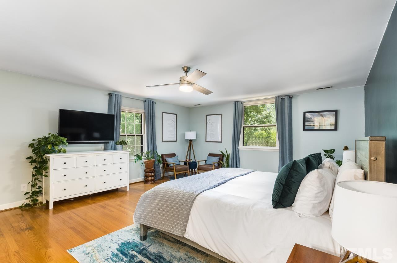 9028 Oneal Road Raleigh, NC 27613 - Photo 17 of 30 a bedroom with a bed and flat screen tv
