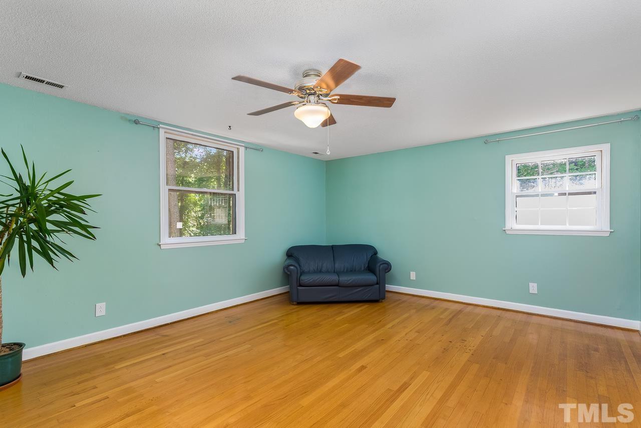 9028 Oneal Road Raleigh, NC 27613 - Photo 24 of 30 a room with window and a ceiling fan