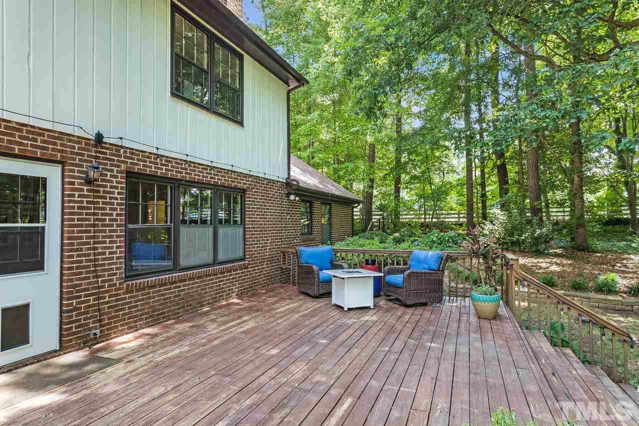 9028 Oneal Road Raleigh, NC 27613 - Photo 26 of 30 a view of a house with backyard sitting area and garden