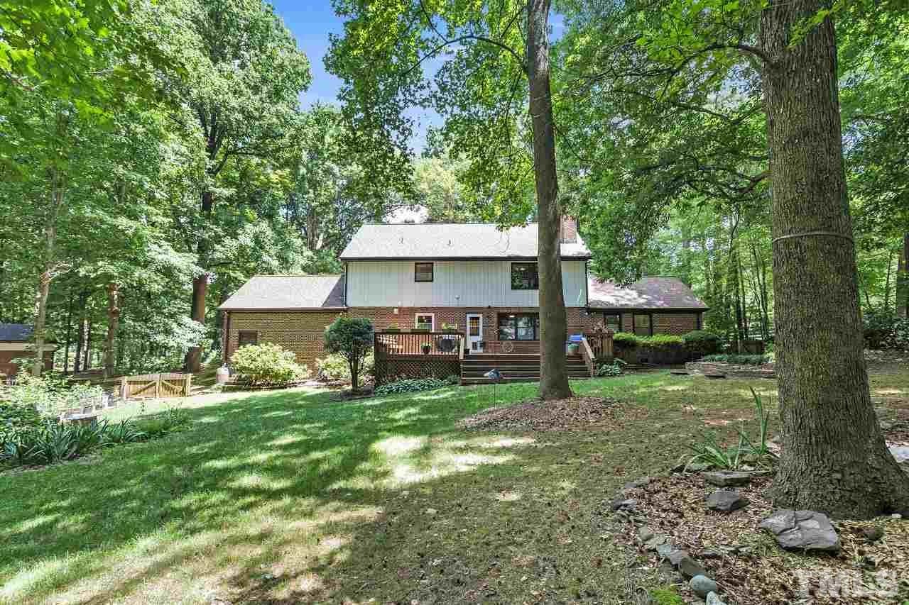 9028 Oneal Road Raleigh, NC 27613 - Photo 27 of 30 a view of a house with backyard and a tree