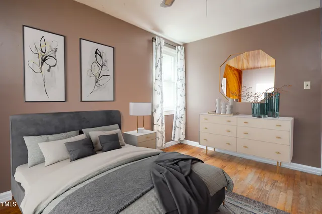 a bed room with a bed and a window