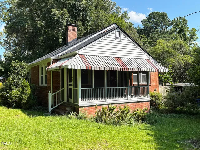 a view of a bird house next to a yard