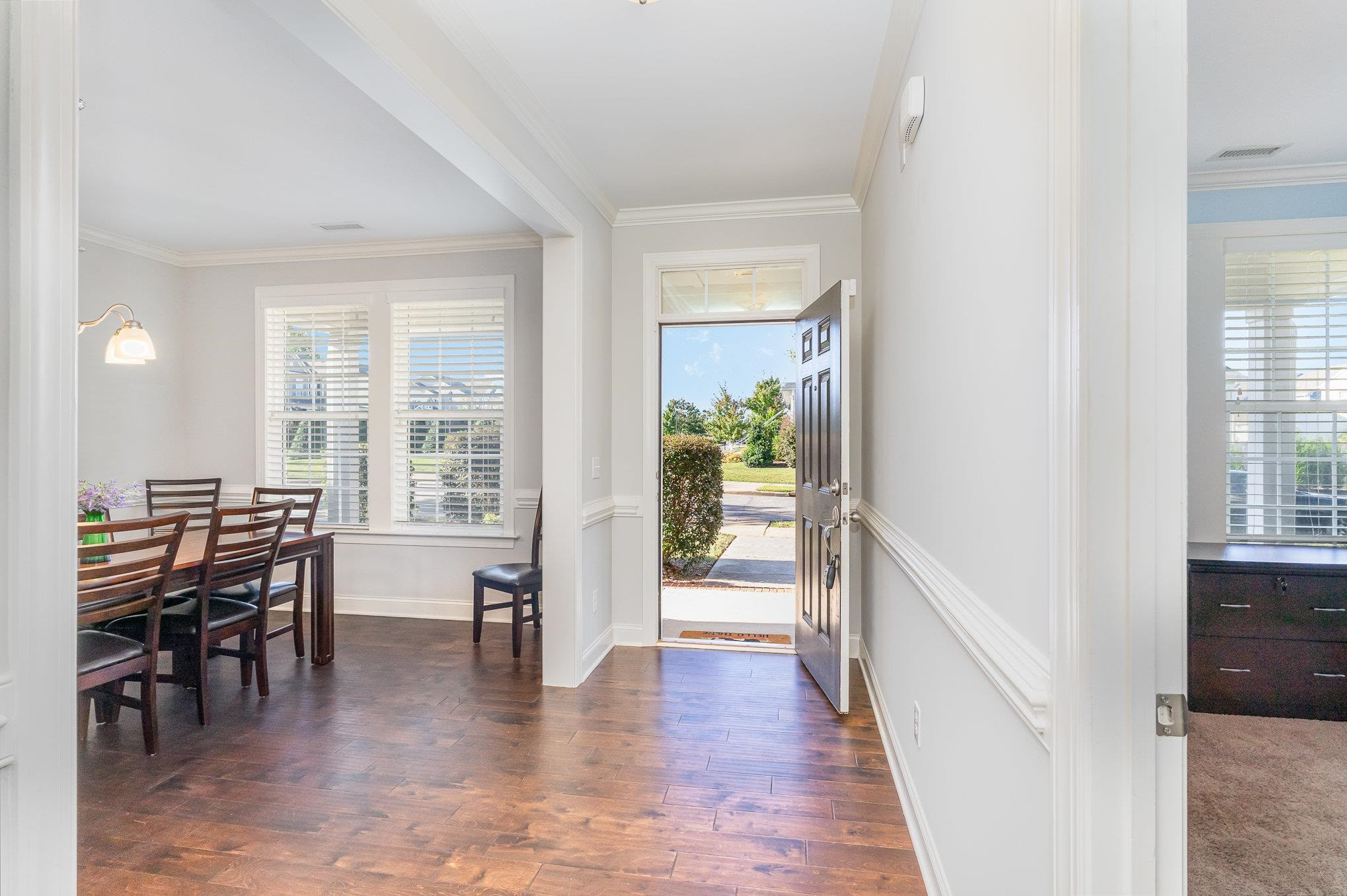 702 Chapanoke Road Raleigh, NC 27603 - Photo 16 of 39 a view of a dining room with furniture and wooden floor