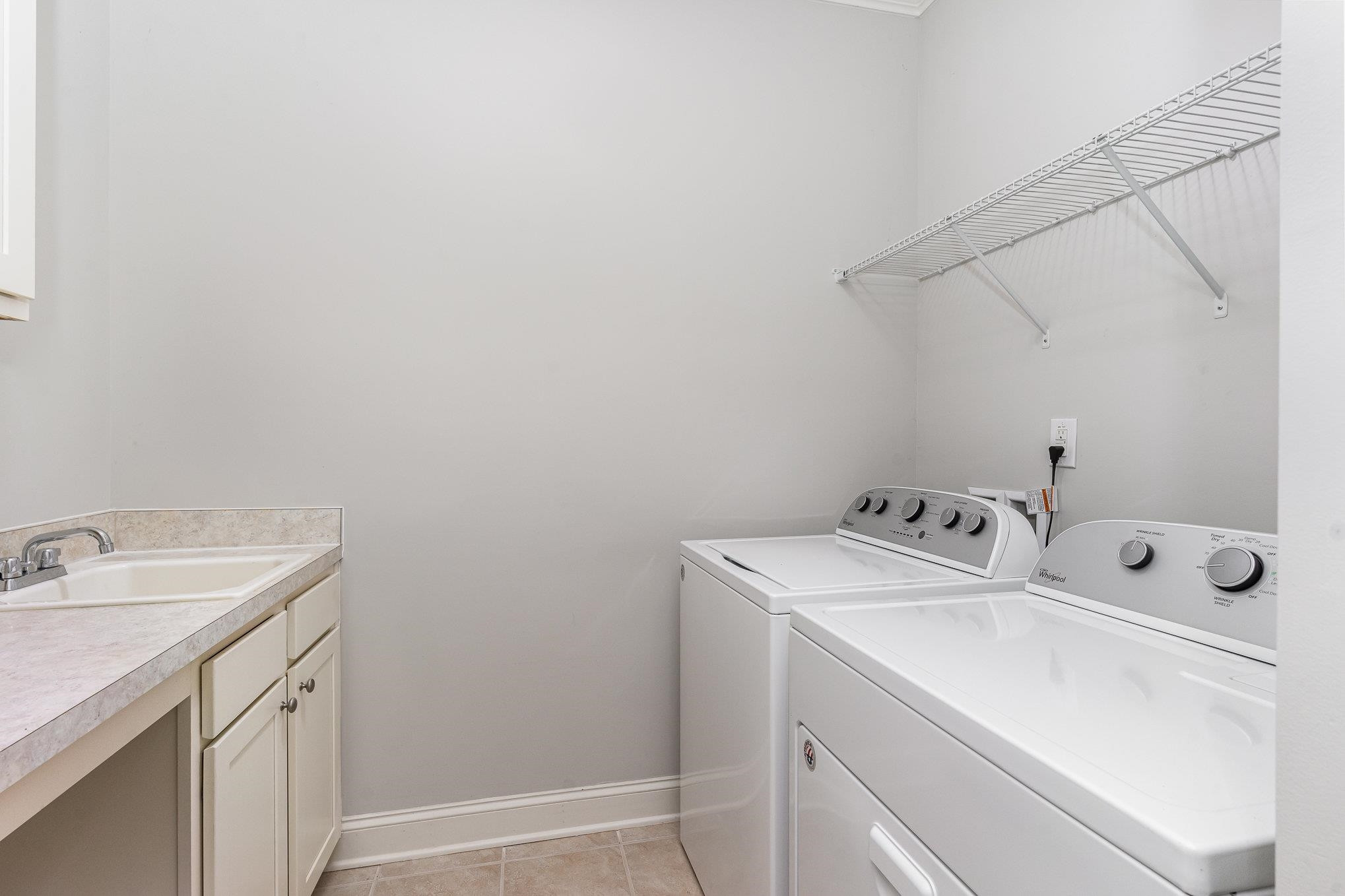702 Chapanoke Road Raleigh, NC 27603 - Photo 18 of 39 a utility room with dryer and washer