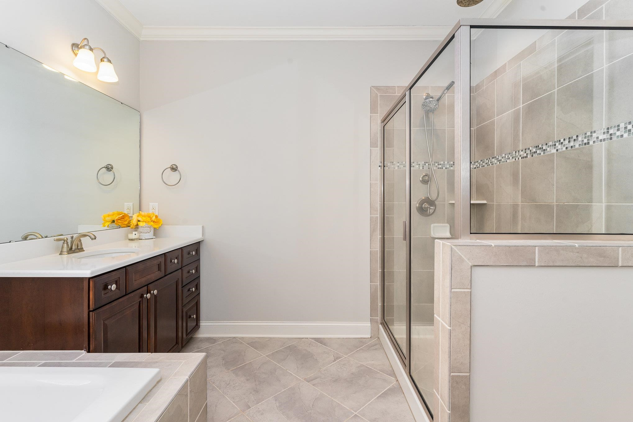 702 Chapanoke Road Raleigh, NC 27603 - Photo 23 of 39 a bathroom with a sink vanity and a mirror