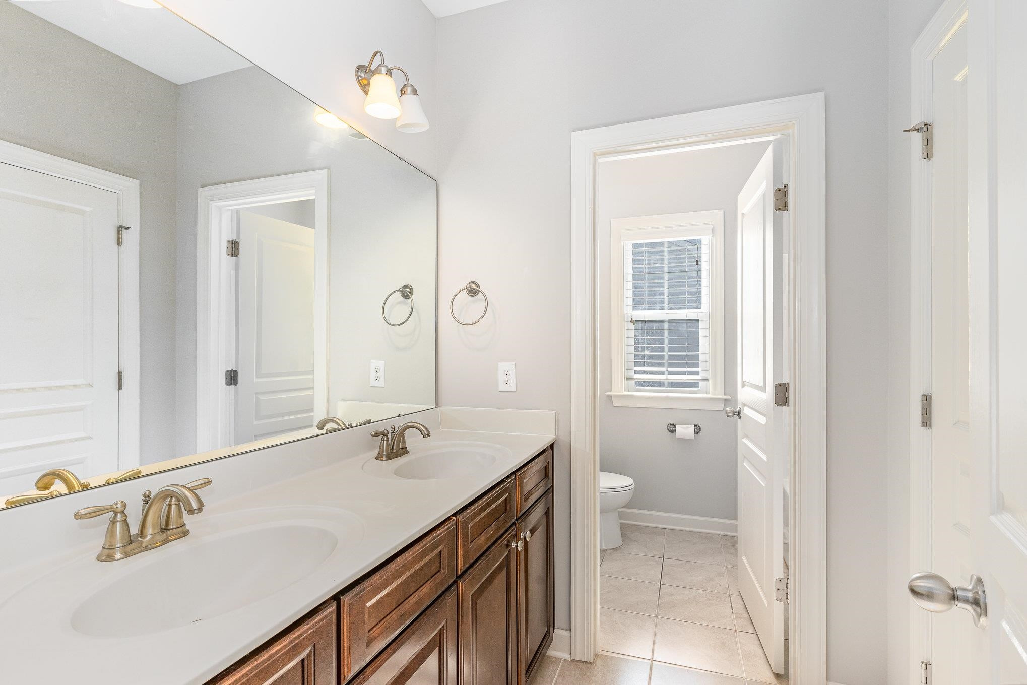 702 Chapanoke Road Raleigh, NC 27603 - Photo 28 of 39 a bathroom with a sink a toilet and shower