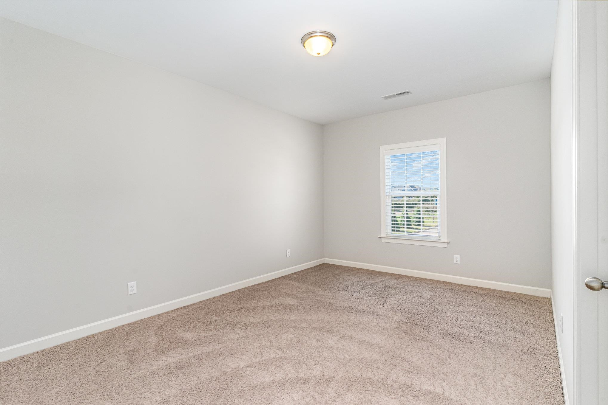 702 Chapanoke Road Raleigh, NC 27603 - Photo 29 of 39 an empty room with windows