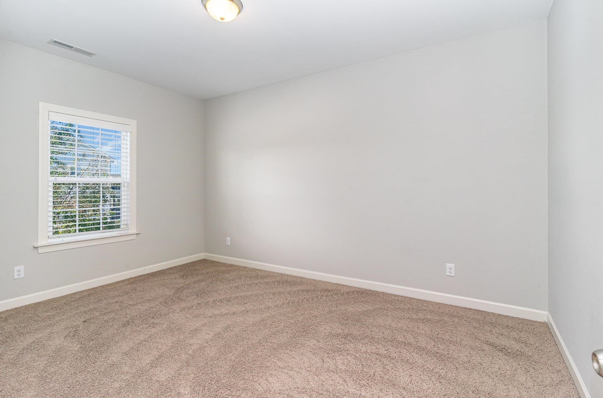 702 Chapanoke Road Raleigh, NC 27603 - Photo 31 of 39 an empty room with a window