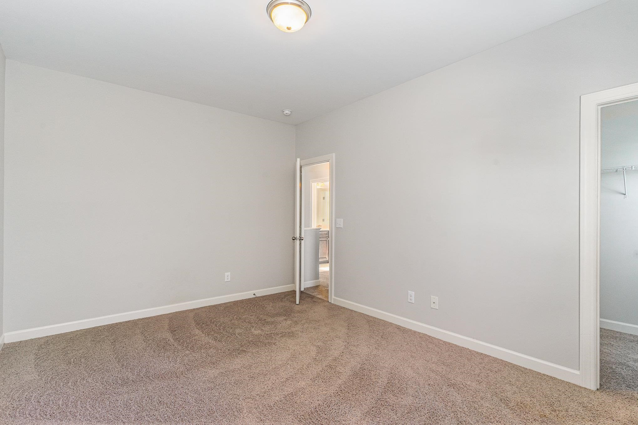 702 Chapanoke Road Raleigh, NC 27603 - Photo 32 of 39 an empty room with windows