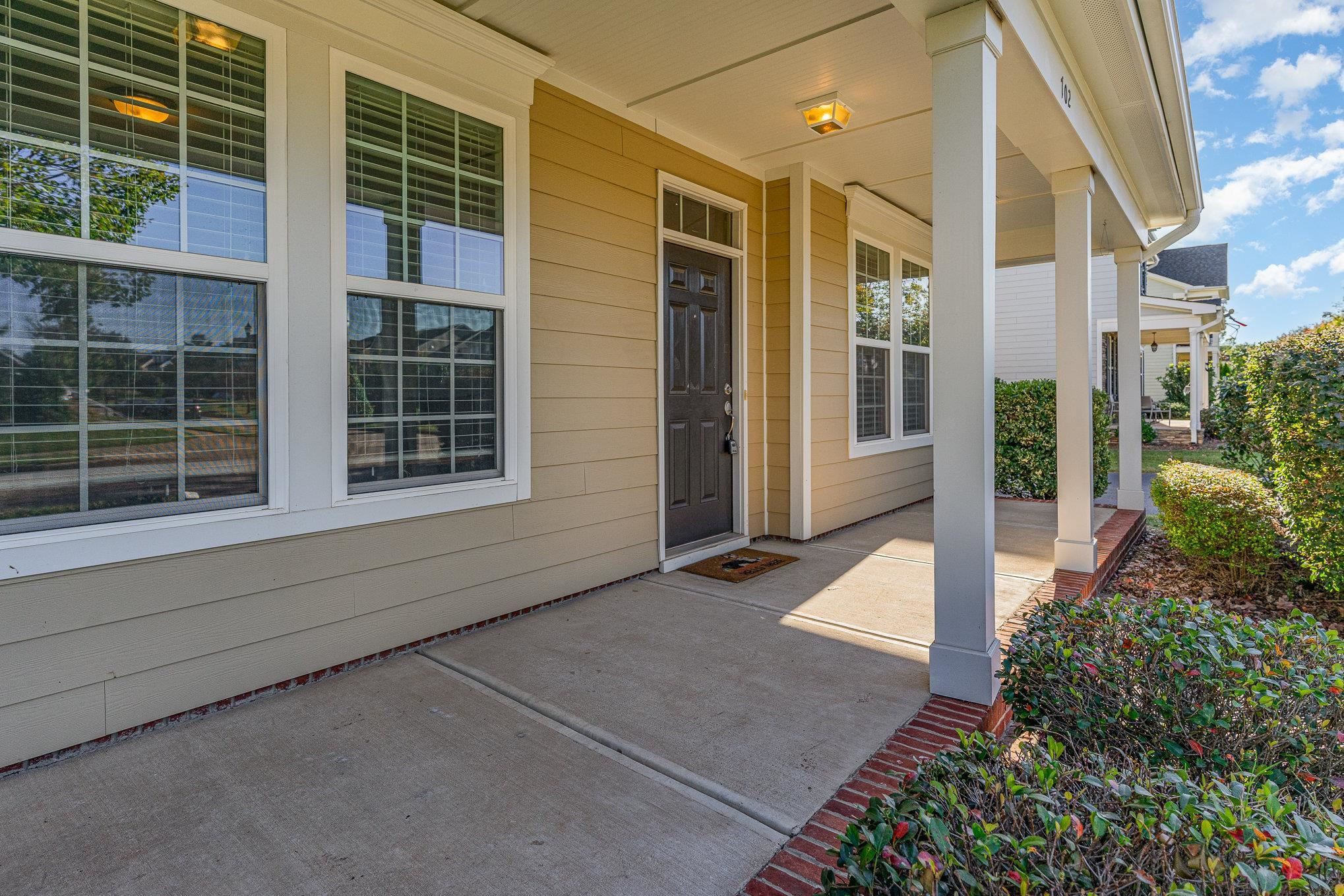 702 Chapanoke Road Raleigh, NC 27603 - Photo 5 of 39 a front view of a house with a yard and garage
