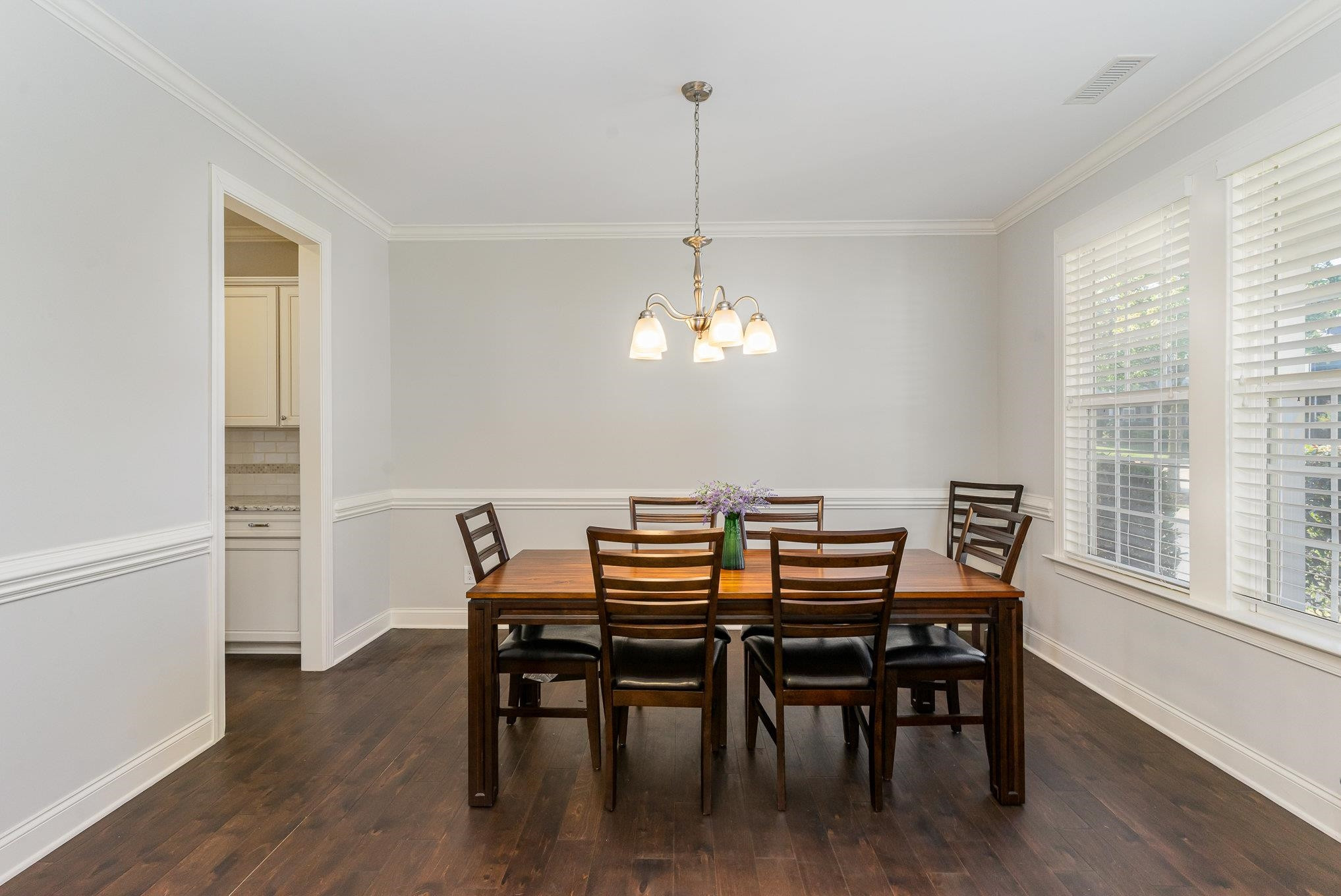 702 Chapanoke Road Raleigh, NC 27603 - Photo 6 of 39 a view of a dining room with furniture window and wooden floor