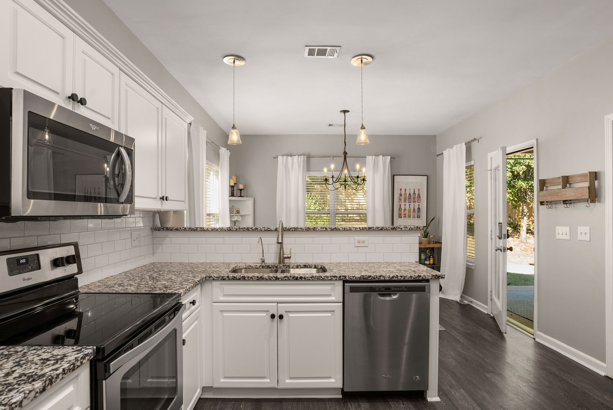 386 Normandy Circle Nashville, TN 37209 - Photo 15 of 30 a kitchen with stainless steel appliances granite countertop a sink stove and refrigerator