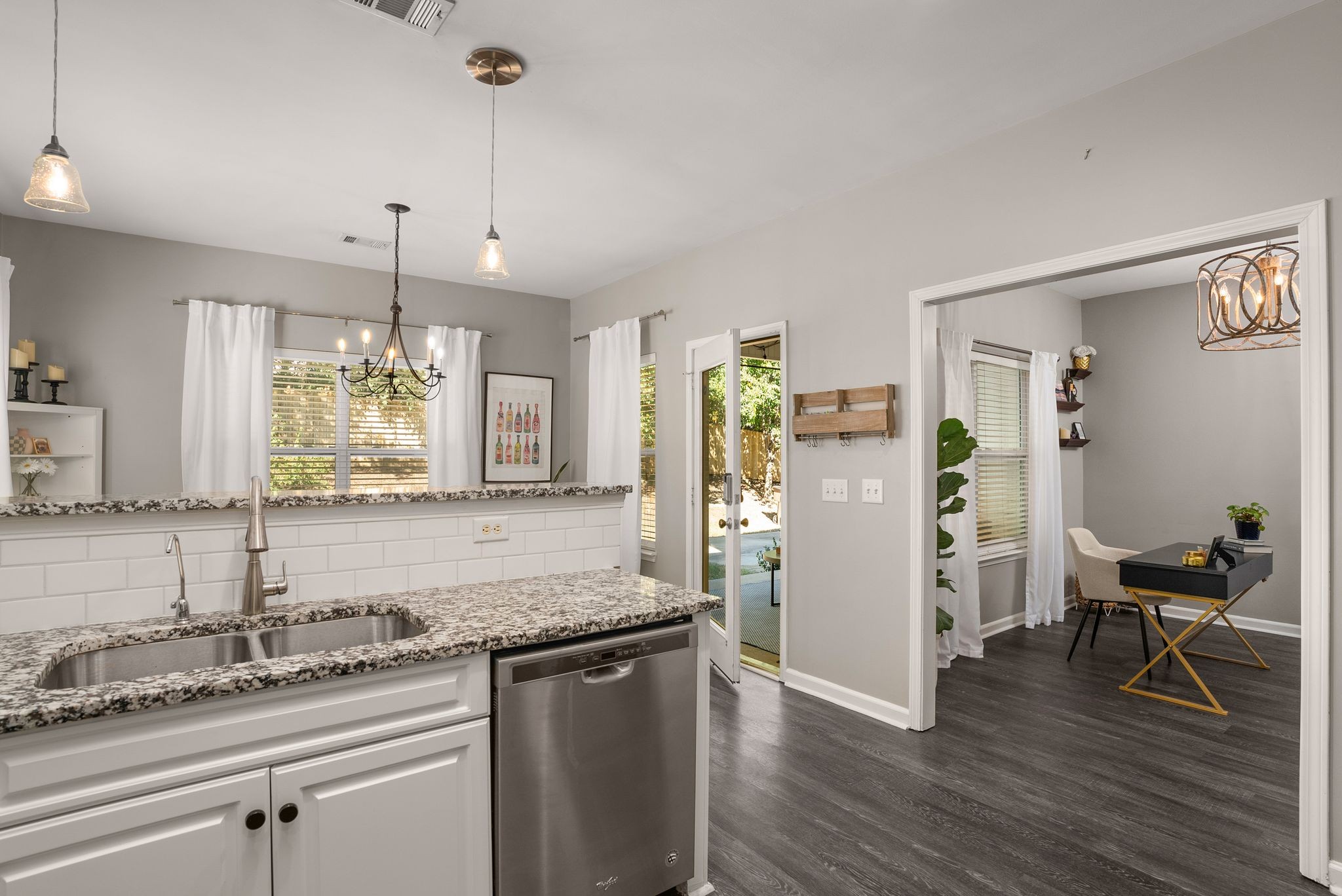 386 Normandy Circle Nashville, TN 37209 - Photo 16 of 30 a kitchen with stainless steel appliances granite countertop a refrigerator a sink dishwasher a stove and white countertops with wooden floor