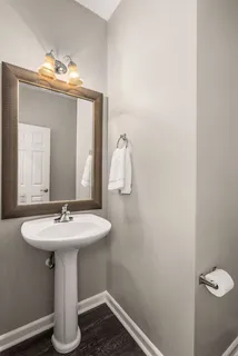 a bathroom with a sink and a mirror