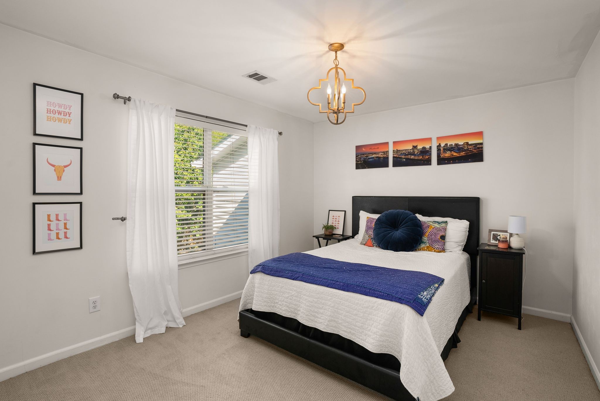 386 Normandy Circle Nashville, TN 37209 - Photo 18 of 30 a spacious bedroom with a bed and a window