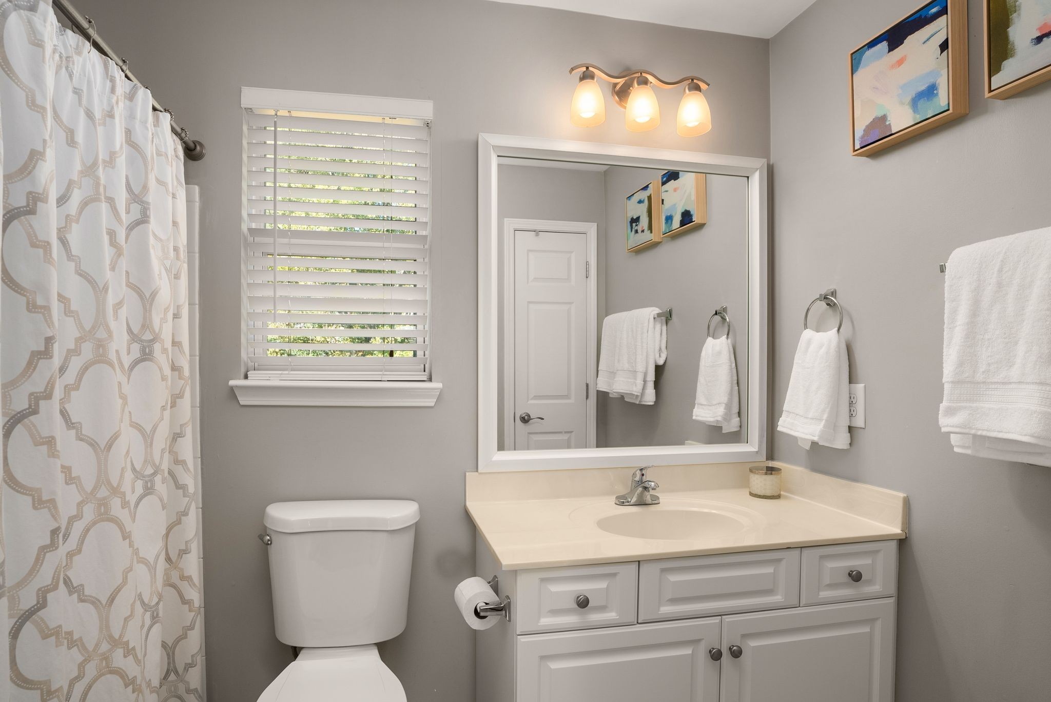 386 Normandy Circle Nashville, TN 37209 - Photo 19 of 30 a bathroom with a toilet sink and mirror