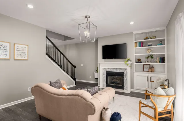 a living room with furniture fireplace and a flat screen tv