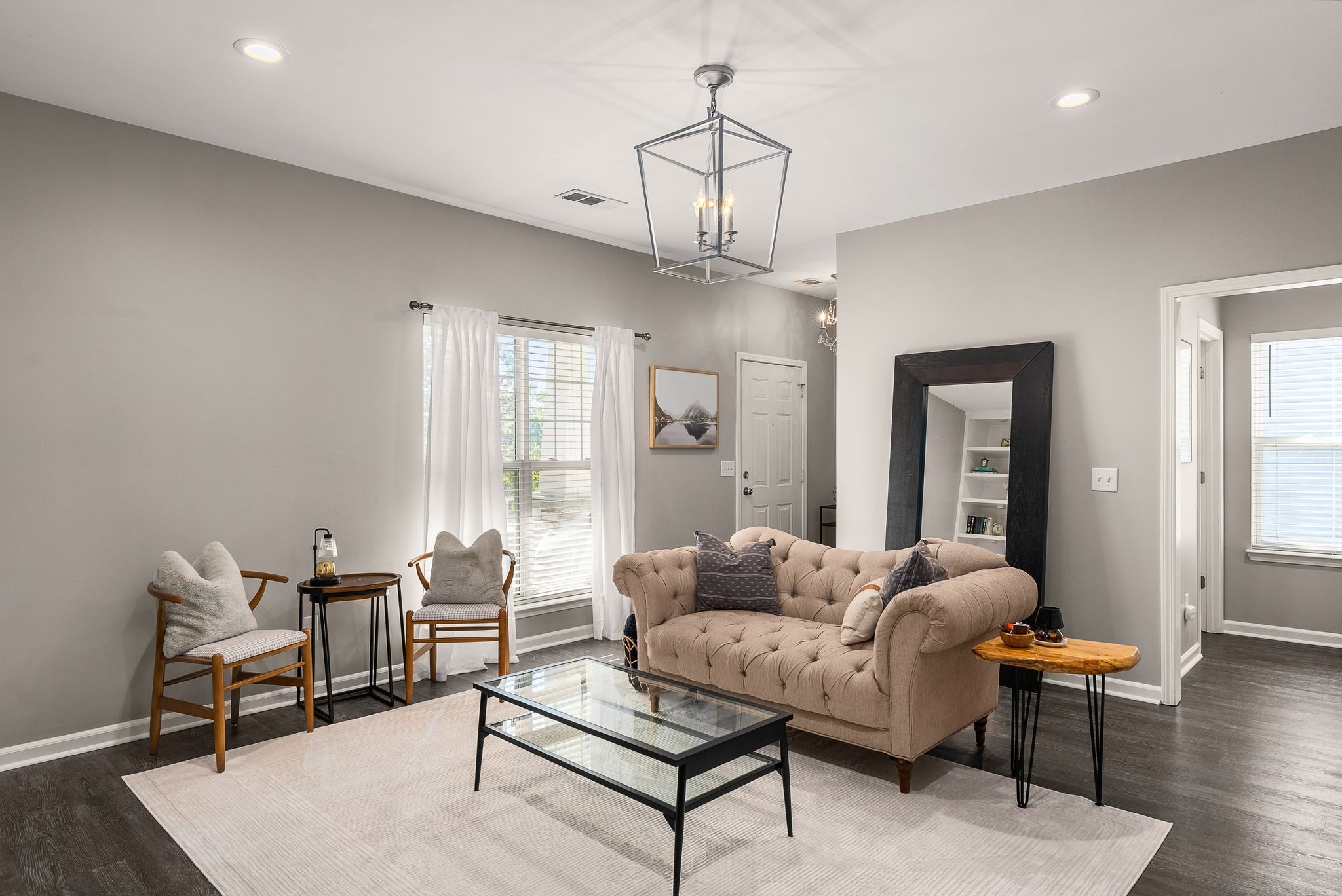 386 Normandy Circle Nashville, TN 37209 - Photo 7 of 30 a living room with furniture a chandelier and a dining table