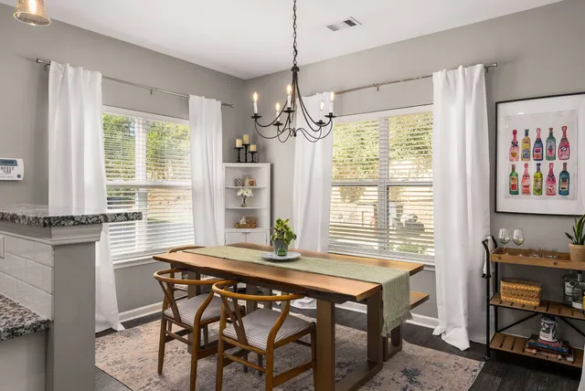 a dining room with furniture and window