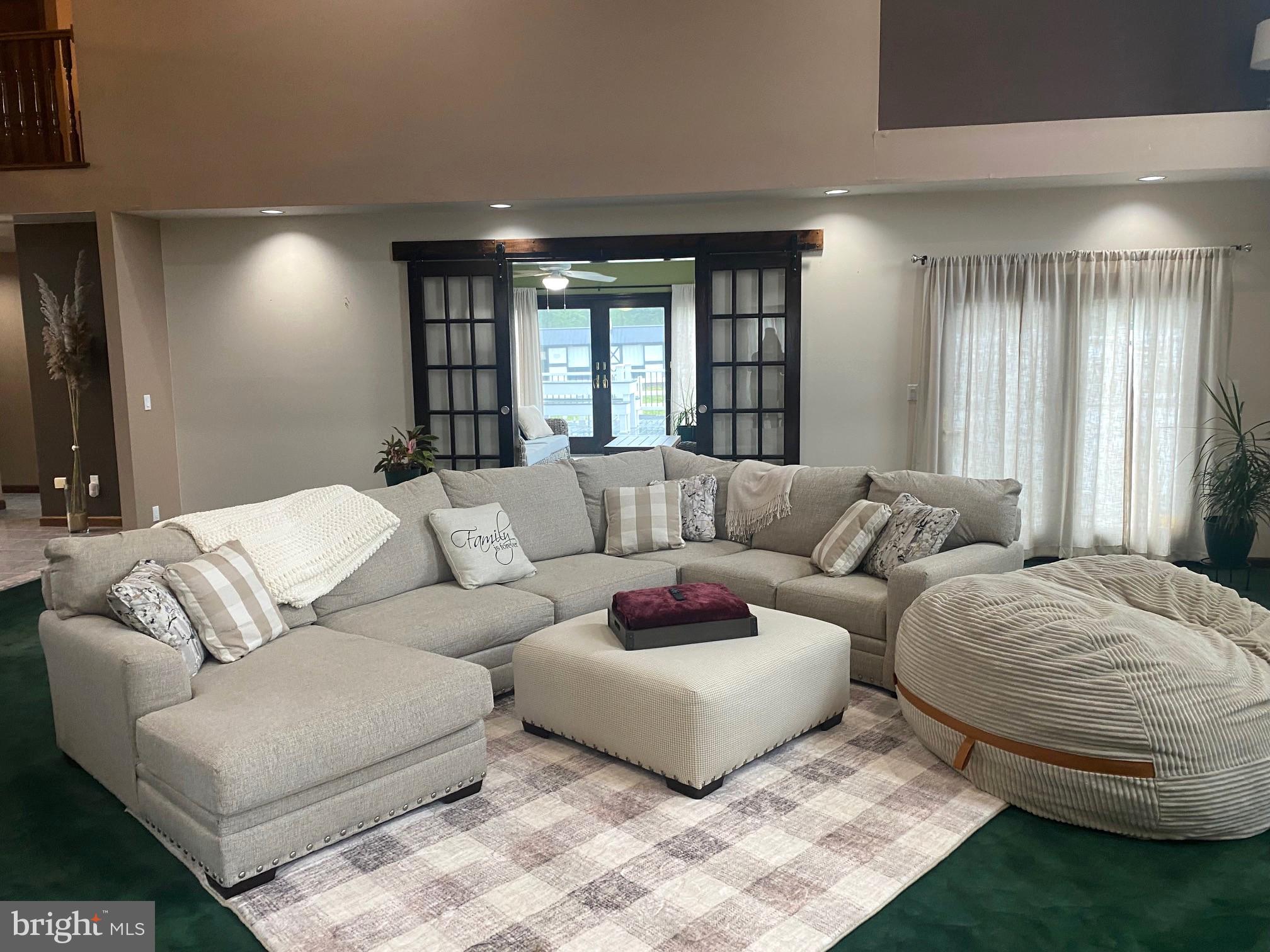 120 Oechsle Road Woodstown, NJ 08098 - Photo 4 of 14 a living room with furniture and a large window