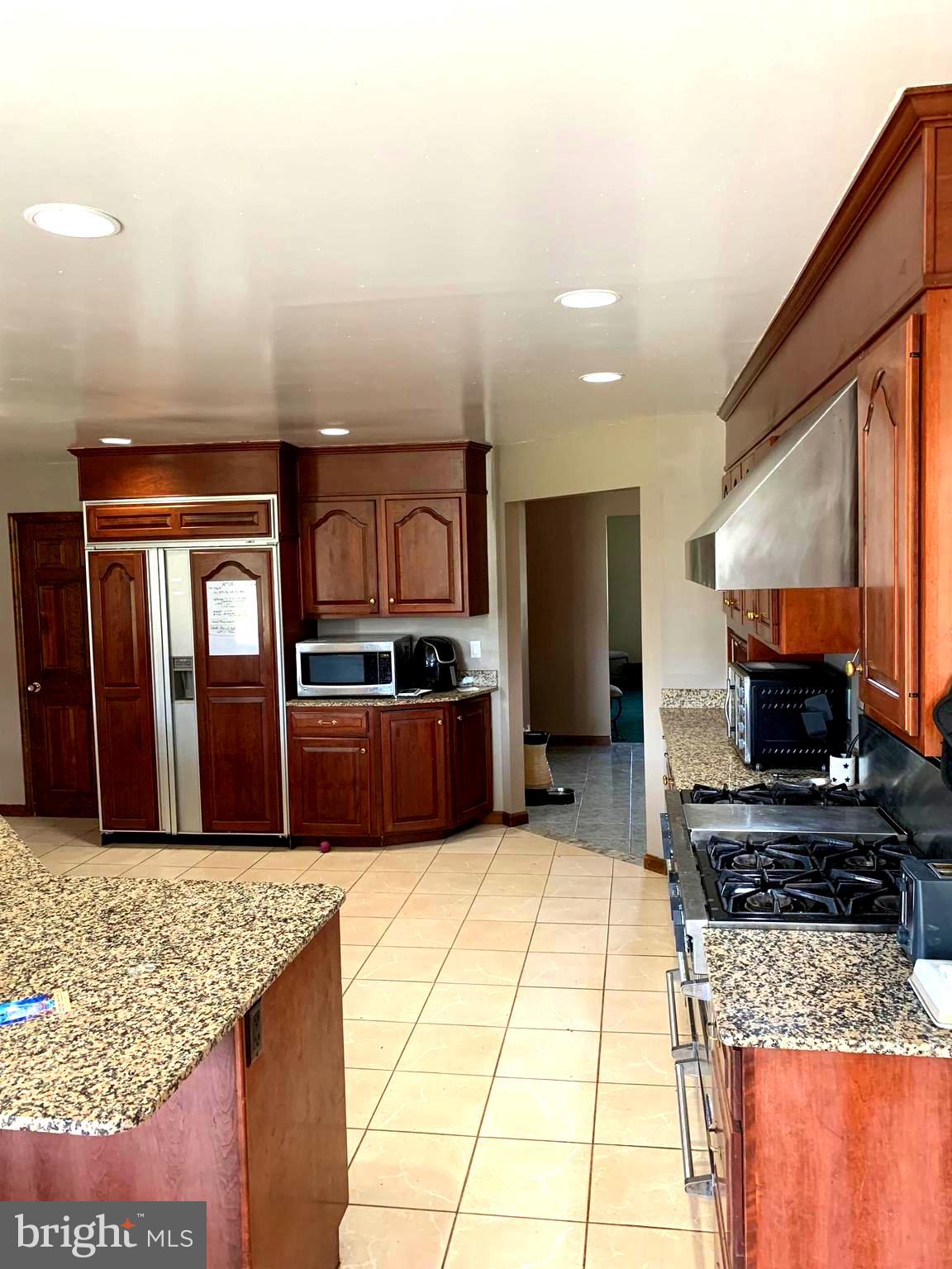120 Oechsle Road Woodstown, NJ 08098 - Photo 5 of 14 a kitchen with stainless steel appliances granite countertop a sink stove and refrigerator