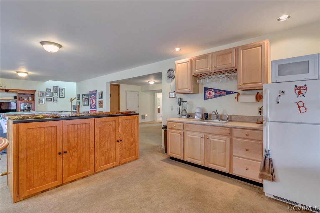 717 Landover Road Troy, VA 22974 - Photo 18 of 48 a kitchen with cabinets a sink and white appliances