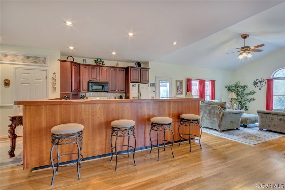 717 Landover Road Troy, VA 22974 - Photo 26 of 48 a kitchen with stainless steel appliances granite countertop a dining table chairs and granite counter tops