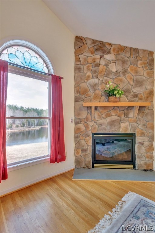 717 Landover Road Troy, VA 22974 - Photo 33 of 48 a living room with a fireplace and a floor to ceiling window