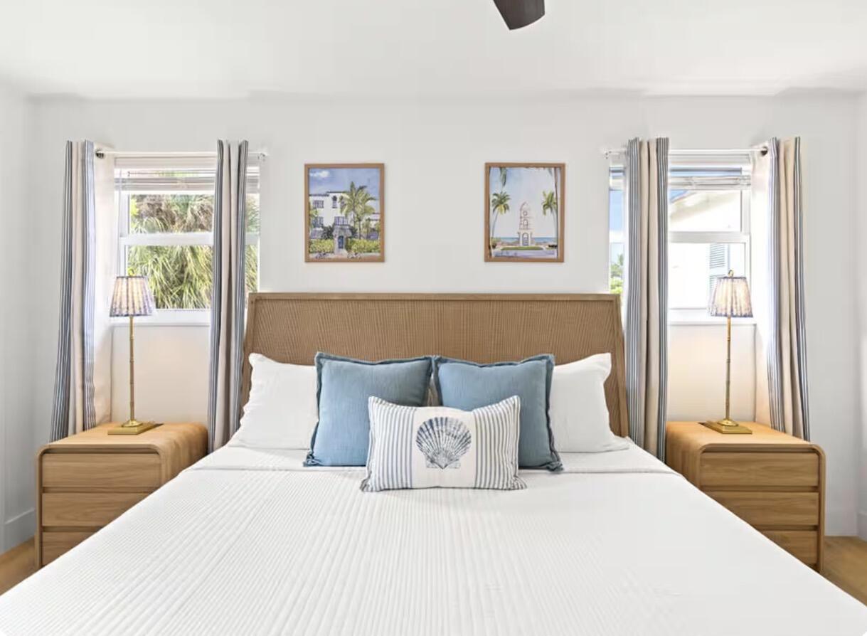 1216 Surf Road Singer Island, FL 33404 - Photo 9 of 15 a bedroom with a bed and a window