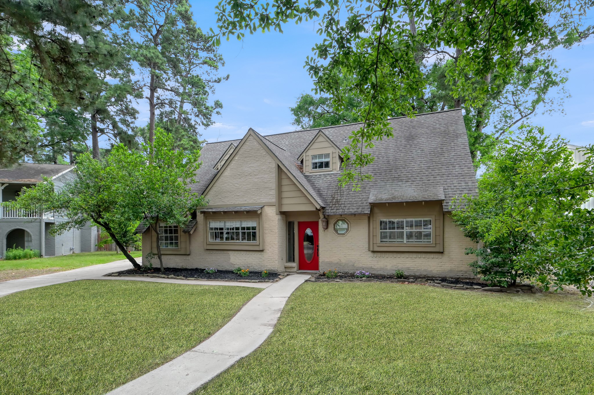 25610 Walnut Grove Circle Spring, TX 77380 - Photo 2 of 29 a front view of a house with a yard and a garage