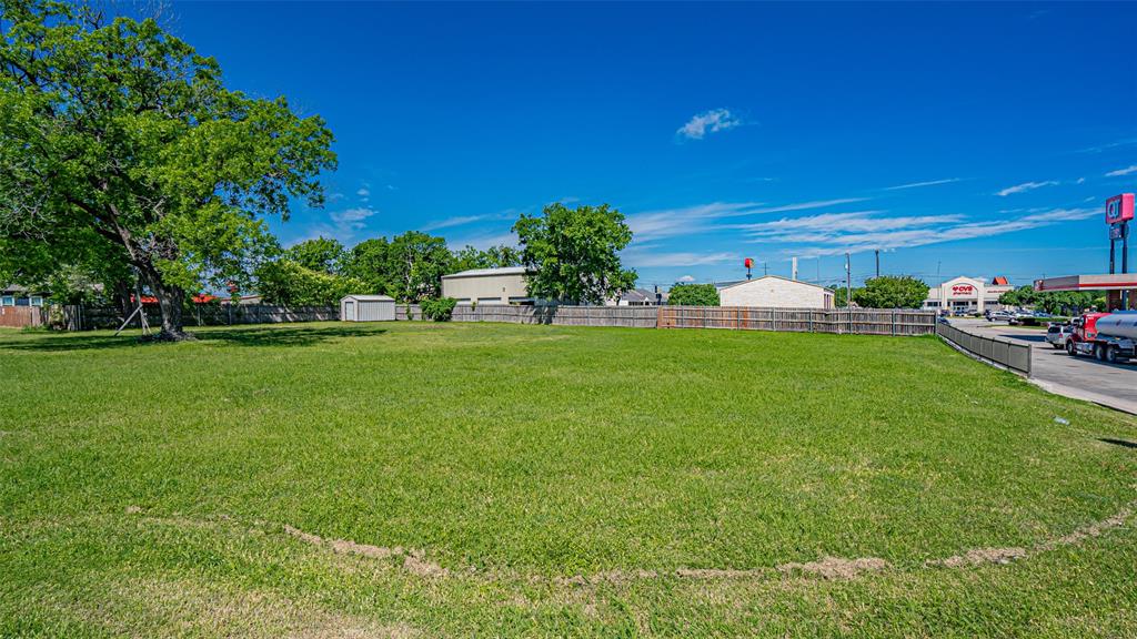 124 Southwest Anderson Street Burleson, TX 76028 - Photo 27 of 36 View of yard with a storage shed and an outdoor structure