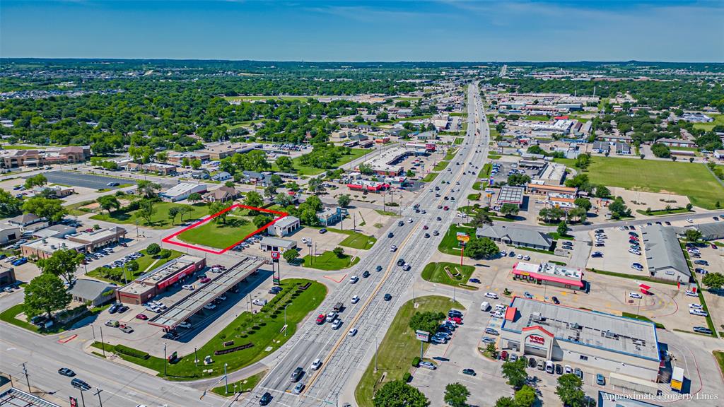 124 Southwest Anderson Street Burleson, TX 76028 - Photo 33 of 36 Aerial overview of property's location featuring a main thoroughfare and property boundaries highlighted
