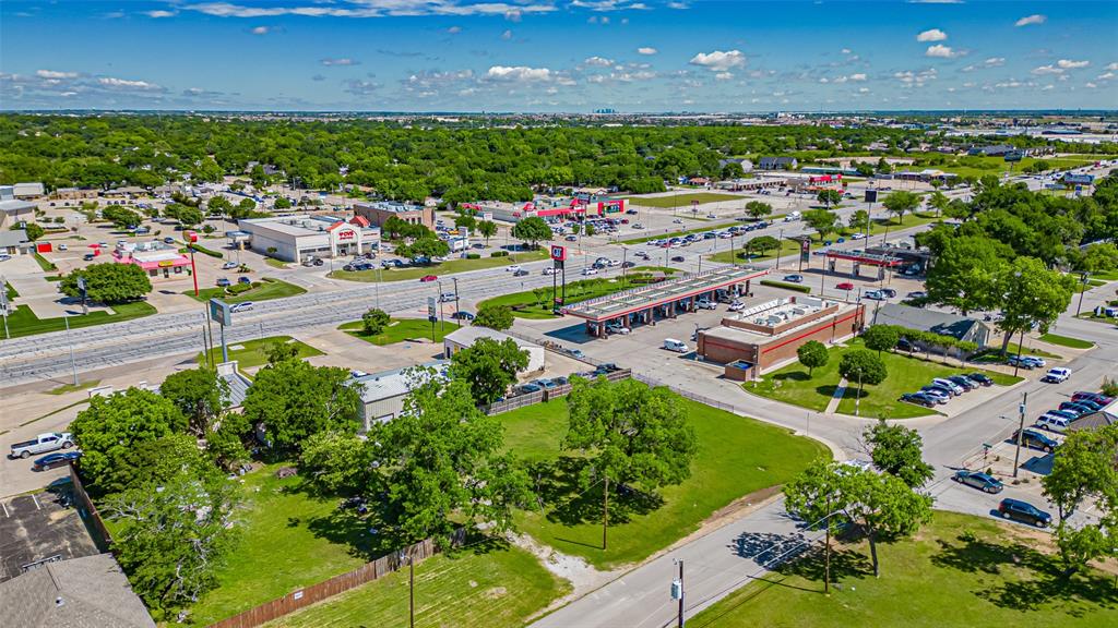 124 Southwest Anderson Street Burleson, TX 76028 - Photo 10 of 36 Drone / aerial view of a tree filled landscape