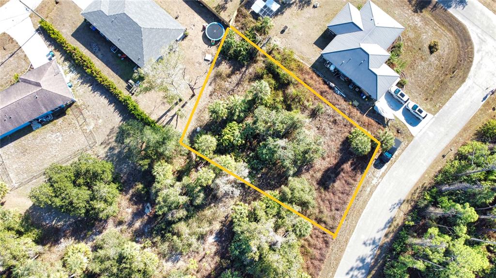 16 Caladium Road North Port, FL 34288 - Photo 20 of 23 an aerial view of a house with a yard and flowers