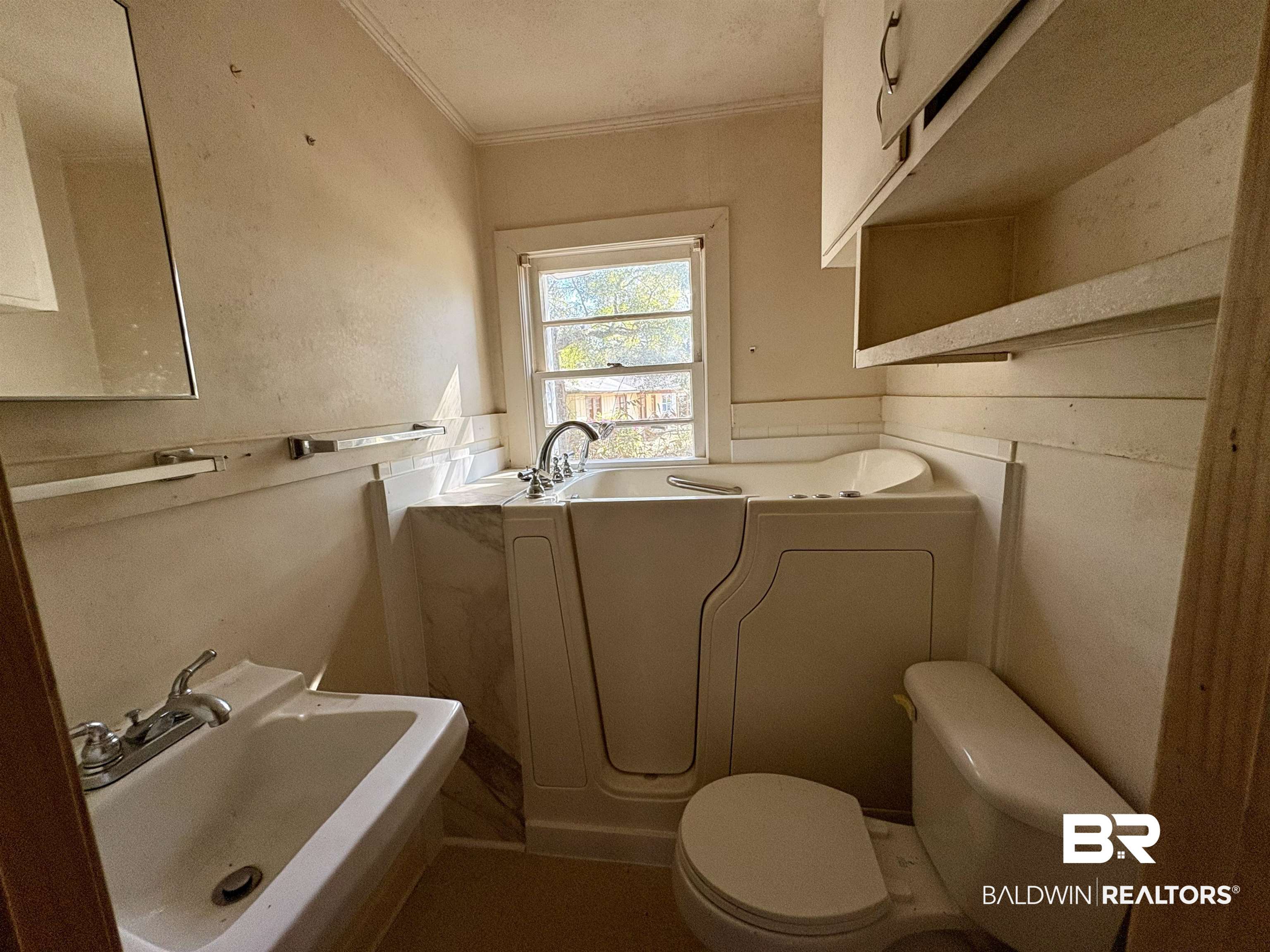 4060 Dickson Lane Mobile, AL 36618 - Photo 12 of 16 Full bathroom featuring a garden tub and ornamental molding