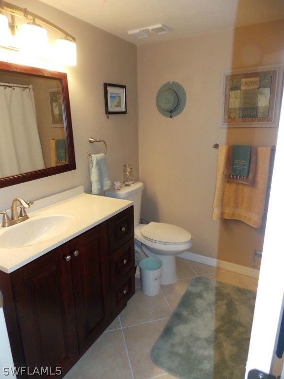 16881 Davis Road, Unit 813 Fort Myers, FL 33908 - Photo 12 of 25 a bathroom with a sink vanity and a toilet