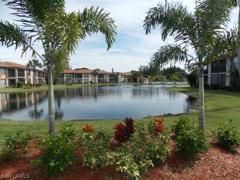 16881 Davis Road, Unit 813 Fort Myers, FL 33908 - Photo 15 of 25 a view of a lake with a house
