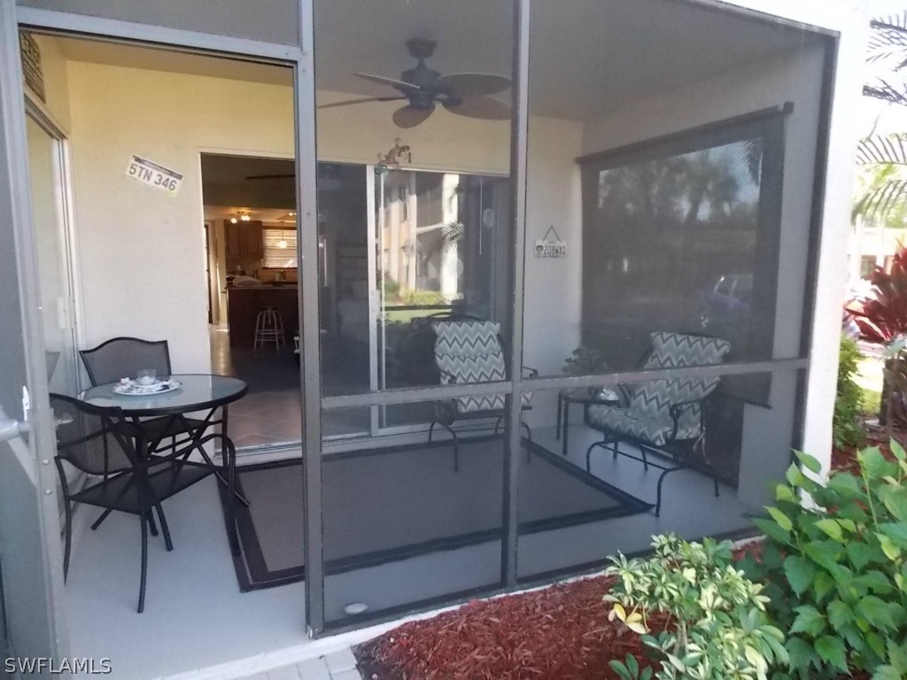 16881 Davis Road, Unit 813 Fort Myers, FL 33908 - Photo 18 of 25 a view of a dining room with furniture and a potted plant