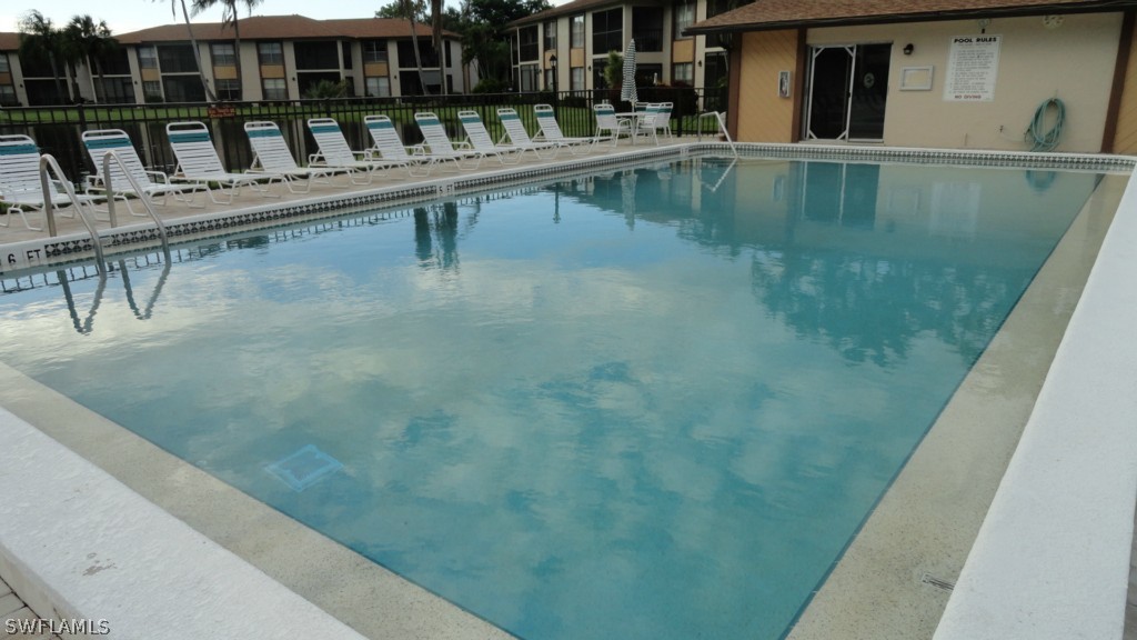 16881 Davis Road, Unit 813 Fort Myers, FL 33908 - Photo 22 of 25 a view of a swimming pool with seating space