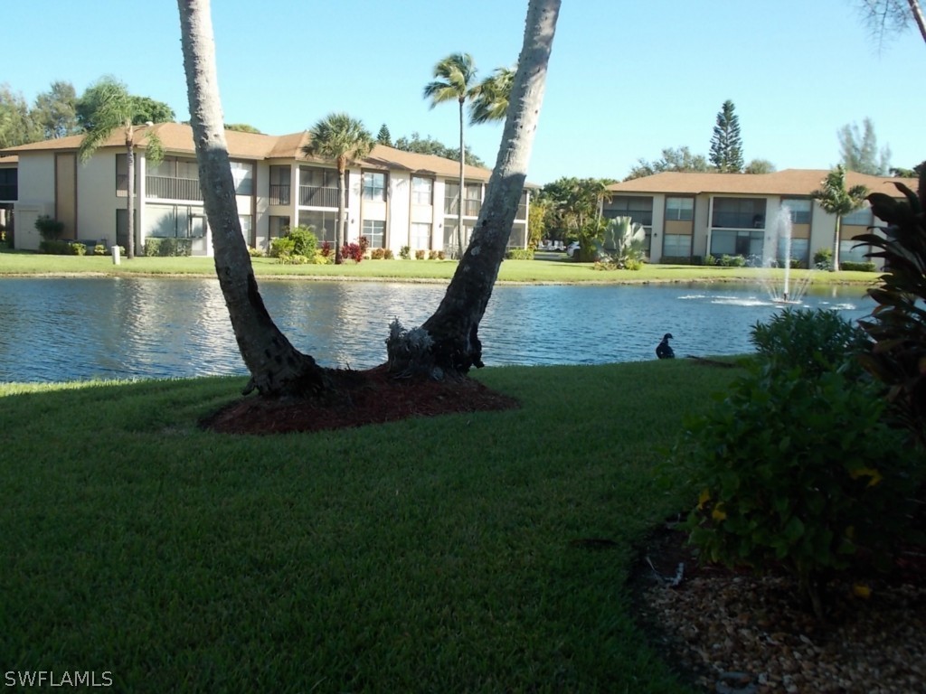 16881 Davis Road, Unit 813 Fort Myers, FL 33908 - Photo 23 of 25 a view of a house with a yard