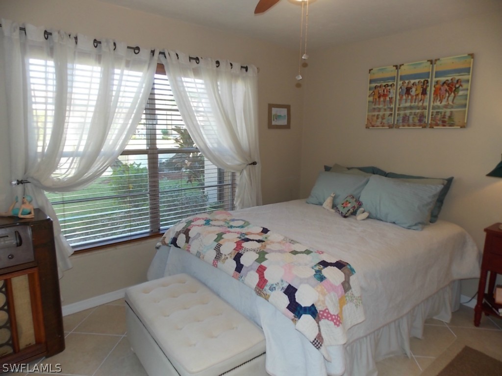 16881 Davis Road, Unit 813 Fort Myers, FL 33908 - Photo 10 of 25 a bedroom with a bed and a window