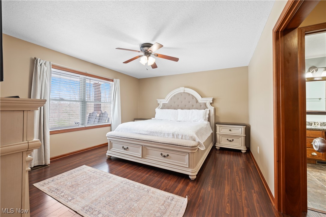 399 Wilder Road Vinton, OH 45686 - Photo 13 of 36 Bedroom featuring dark wood-style floors, a ceiling fan, and a textured ceiling