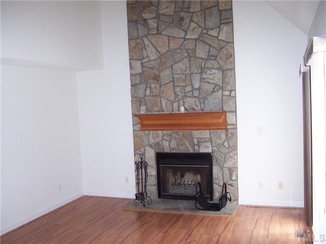 4513 Birmingham Way Raleigh, NC 27604 - Photo 4 of 8 a room with a fireplace