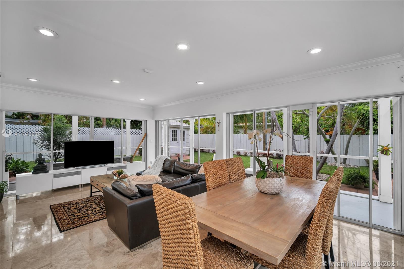 774 Fernwood Road Key Biscayne, FL 33149 - Photo 2 of 36 a living room with fireplace furniture and a flat screen tv