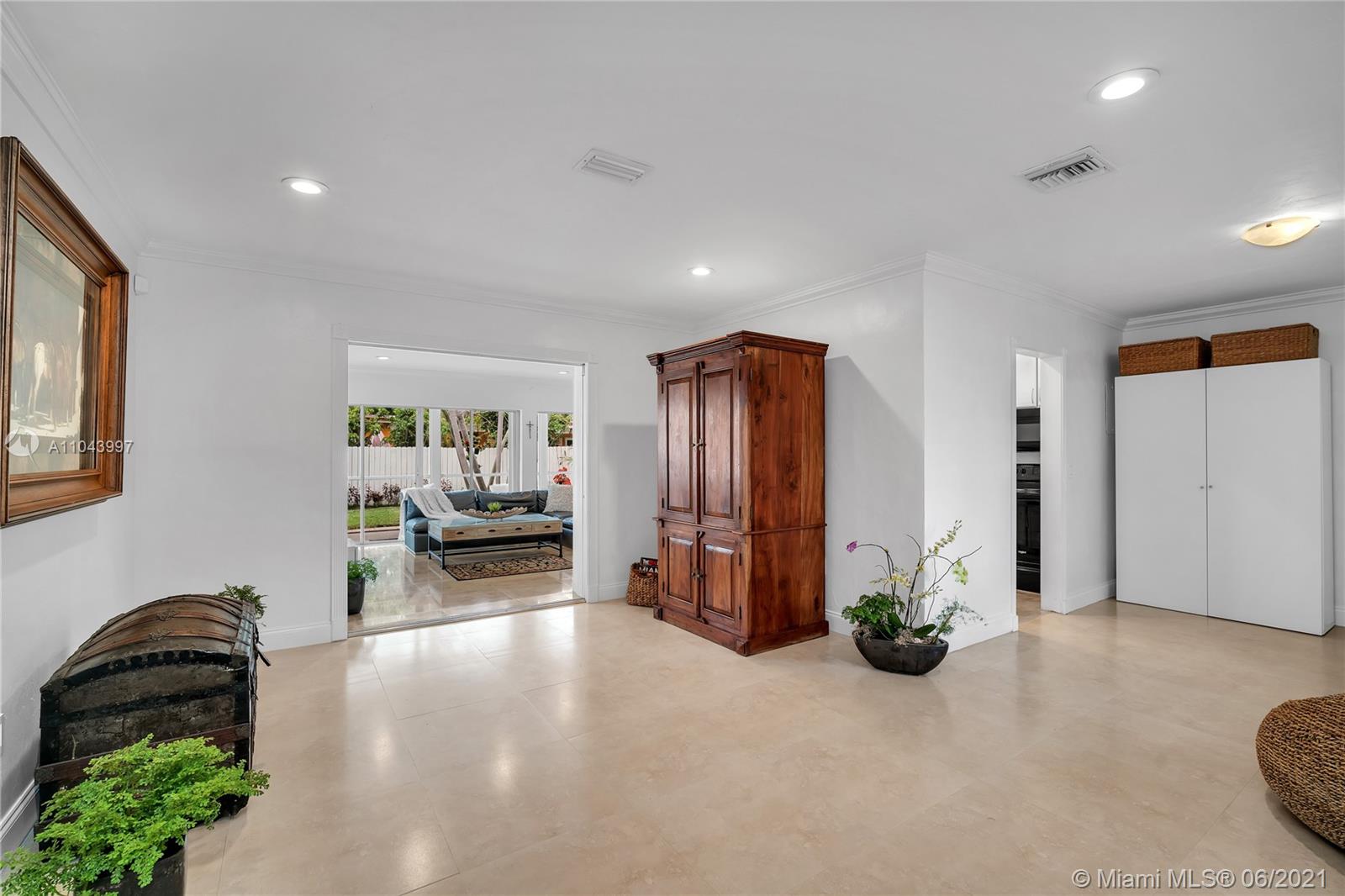 774 Fernwood Road Key Biscayne, FL 33149 - Photo 15 of 36 a view of a livingroom with furniture and a ceiling fan