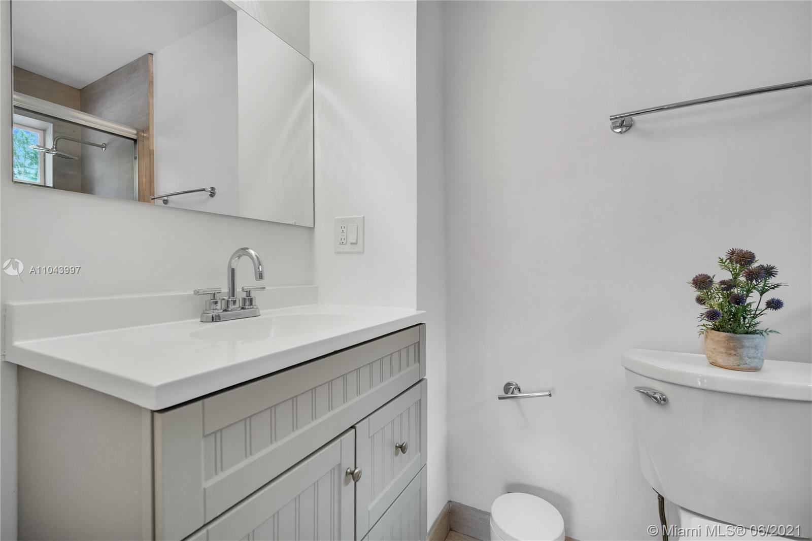 774 Fernwood Road Key Biscayne, FL 33149 - Photo 24 of 36 a bathroom with a sink toilet and vanity