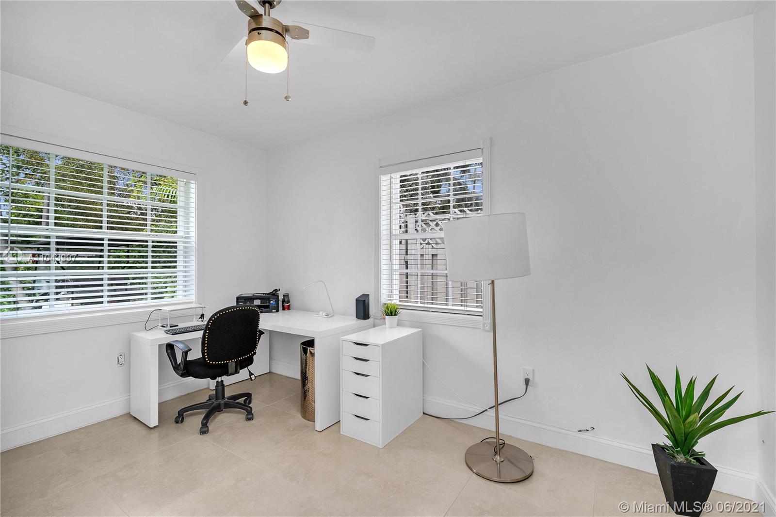 774 Fernwood Road Key Biscayne, FL 33149 - Photo 28 of 36 a view of a workspace with furniture and a window